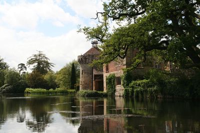 View of the castle against the background of the moat and the garden