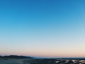 Scenic view of calm sea against clear sky