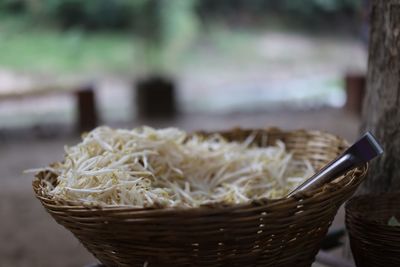Close-up of rice in basket on table