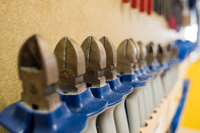 Close-up of work tools arranged in row