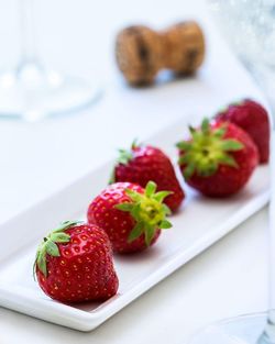 Close-up of strawberries in plate on table