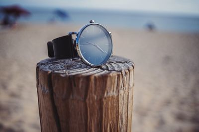 Close-up of wooden post on beach