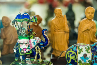 Close-up of buddha statue on table