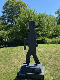 Man statue in park on sunny day