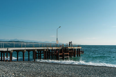 Scenic view of sea against clear blue sky