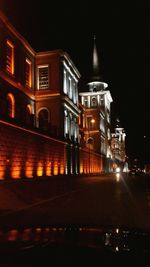 View of illuminated tunnel at night