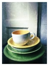 Close-up of coffee cup on table