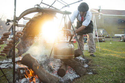 Argentinian man preparing barbecued meat