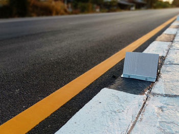 Close-up of zebra crossing on road