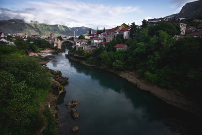 High angle view of river amidst buildings in town