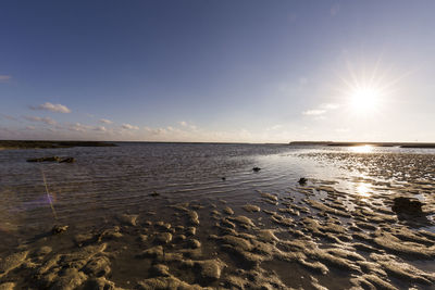 Scenic view of sea against sky at sunset