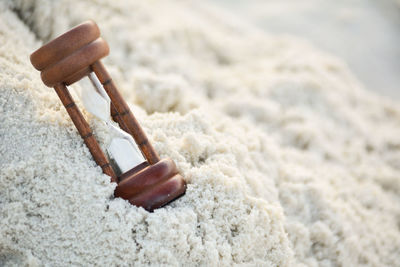 Close up of hourglass on sand