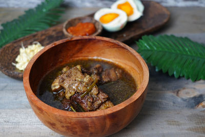 High angle view of ribs soup in bowl on table