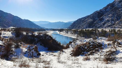 Scenic view of mountains against sky during winter