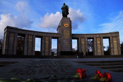 Statue of historic building against sky