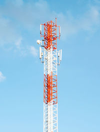 Low angle view of communications tower against sky