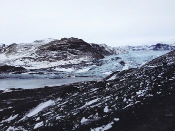 Scenic view of snow covered mountains