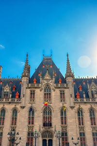 Low angle view of building against blue sky