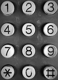 Close-up of clock on white wall