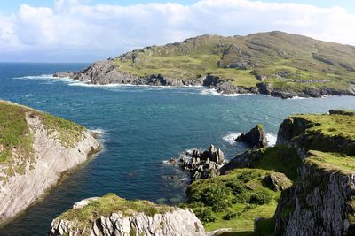 Scenic view of mountains by sea