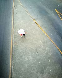 High angle view of people on road