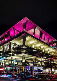 Low angle view of illuminated city at night