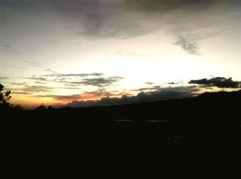 Silhouette landscape against sky during sunset