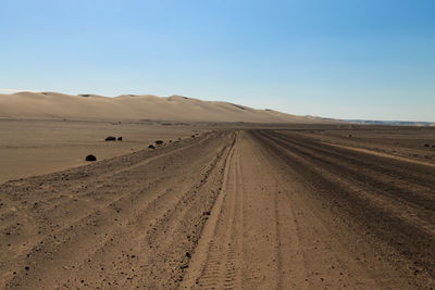 Scenic view of desert against clear sky