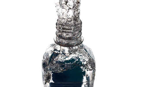 Close-up of glass bottle against white background