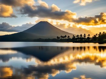 Scenic view of lake against sky during sunset