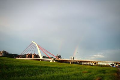 Built structure on field against sky