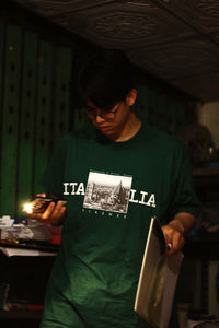 Portrait of young woman sitting at home