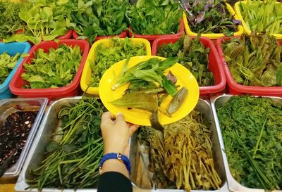 High angle view of woman for sale at market stall