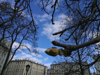 Low angle view of building against cloudy sky