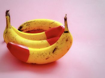 Close-up of yellow fruit against white background