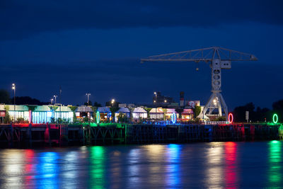 Illuminated harbor at dusk