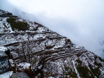 Snowcapped mountain in foggy weather