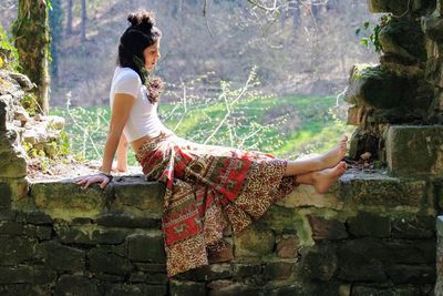 Side view of woman standing outdoors