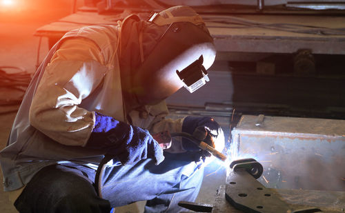 Man working on metal structure