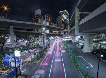 High angle view of illuminated city street at night