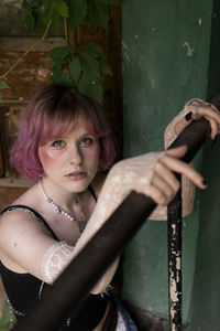 Portrait of young woman standing outdoors