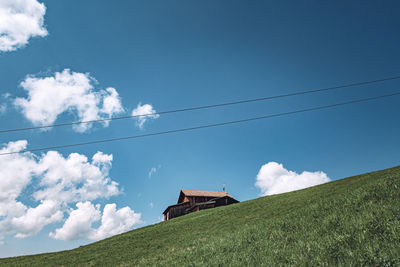 Low angle view of electricity pylon against sky