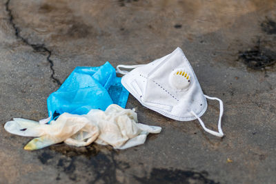 High angle view of garbage on sand