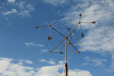 Low angle view of communications tower against sky