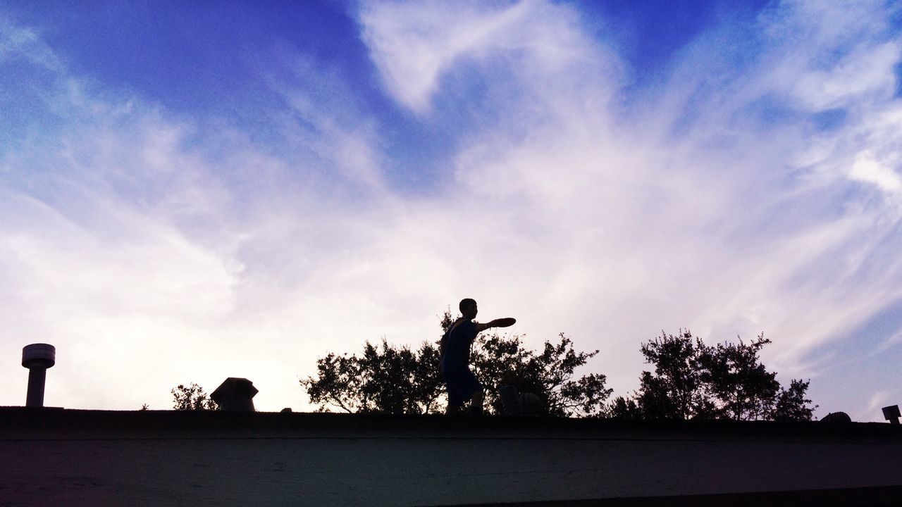 silhouette, sky, low angle view, tree, cloud - sky, cloud, sunset, outline, nature, men, street light, full length, blue, outdoors, dusk, standing, sunlight, lifestyles