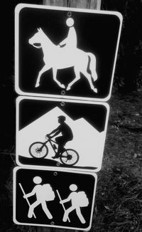 Close-up of bicycle sign at night