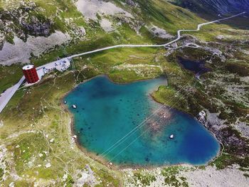 High angle view of lake amidst land