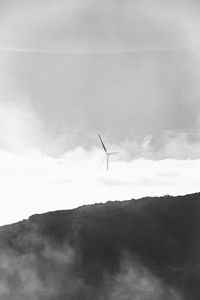 Wind turbine generating power for the city of funchal on madeira island emerging 