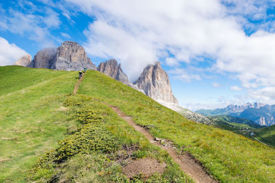 Panoramic view of land and mountains against sky