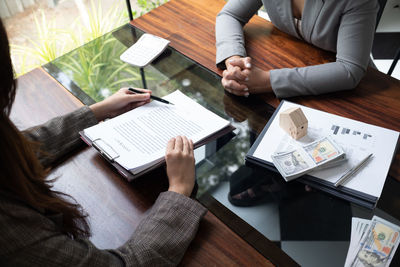 Midsection of business colleagues working at office